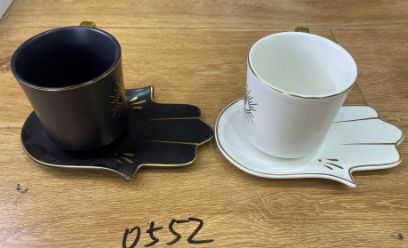 Coffee cups with hand-shaped saucers
