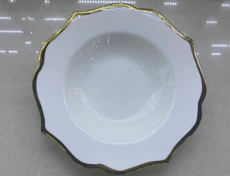 White deep plate with a wavy rim