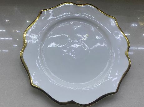 White plate with a gold rim
