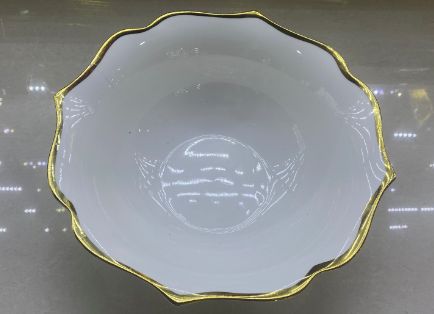 White bowl with a gold rim