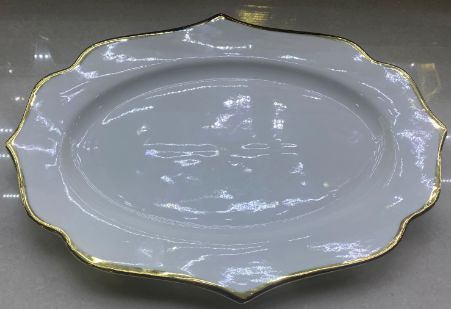 White oval plate with a wavy rim