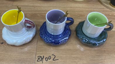 Colourful coffee cups with spoons