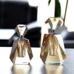 Faceted amber glass bottles, pair
