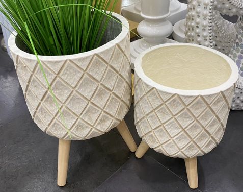 Diamond-pattern planters on wooden legs