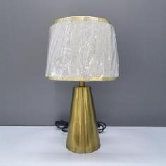 Table lamp with a pleated shade and gold base