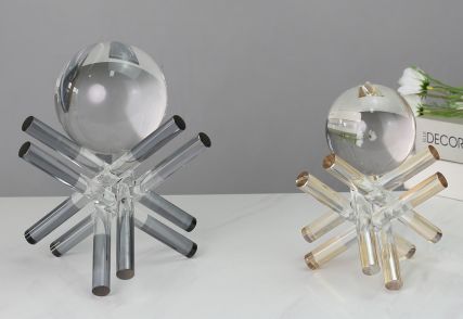 Glass sphere sculptures on crossed stands