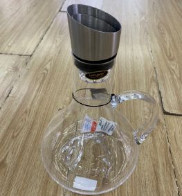 Glass jug with a handle and steel lid