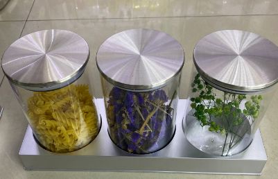 Glass canisters on a stand, set of 3