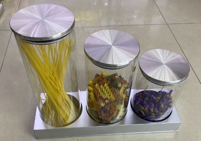 Glass canisters in three heights on a stand