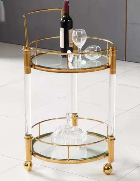 Round gold and glass serving cart
