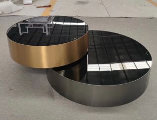 Round gold and black coffee tables, pair
